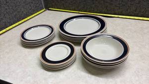 lot 1390 image: Navy Blue and Orange Stripe Dinnerware Set - Plate setting of 4