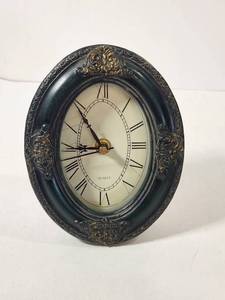 lot 141 image: Oval Quartz Clock with Ornate Frame
