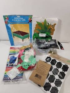 lot 312 image: Tropical Party Supplies Bundle with Table Fringe and Decorations