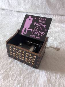 lot 2524 image: Hand Crank Mini Music Box with Engraved Wooden Design