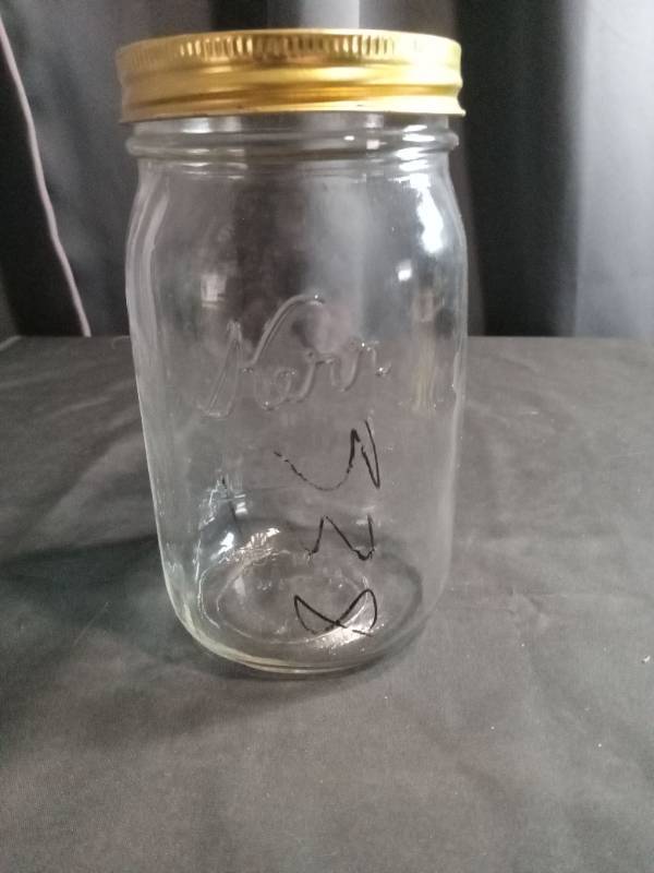 lot 3510 image: Glass Mason Jar with Gold Lid and Decorative Design