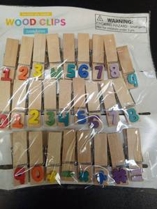 lot 1174 image: Wooden Clothespins with Colorful Numbers for Home Decoration, Craft Project, and Office Organization - Retail $10