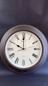 lot 42 image: 15 Inch Bulova Quartz Battery Wall Clock with Roman Numerals