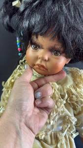 lot 75 image: Large (12 Inches Seated) Native American Style Porcelain Doll with Traditional Outfit