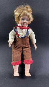 lot 79 image: Porcelain Boy Doll Andy the Engineer from Yesterdays Dreams Collection Approximately (12 inches tall)