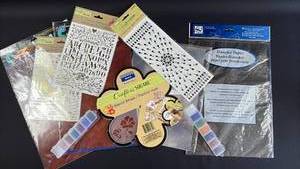 lot 141 image: Mixed Craft Supplies Bundle with Stencils, Transfers, Glass Beads, Stickers, Leather Look Paper