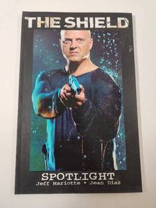 lot 274 image: The Shield Spotlight Trade Paperback by Jeff Mariotte and Jean Diaz