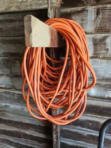 lot 7023 image: Orange Extension Cord with Standard Plug