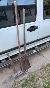 lot 7046 image: Long Handle Garden Tool Set with Flat Shovel, Machete, and Rake