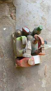 lot 7057 image: Used Paint Spray Can Collection with Cleaning Supplies