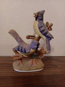 lot 14 image: Porcelain Blue Jay Figurine on Tree Branch