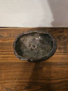 lot 50 image: Handcrafted Green Ceramic Bowl with Speckled Glaze