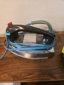 lot 98 image: General Electric Steam Iron with Chrome Base