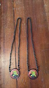 lot 3054 image: Wichita State Shockers Basketball Medallion Necklaces