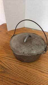 lot 3091 image: Cast Iron Dutch Oven with Lid and Wire Handle