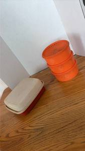 lot 3093 image: Tupperware Orange Starburst Bowls and Cream Storage Container Set