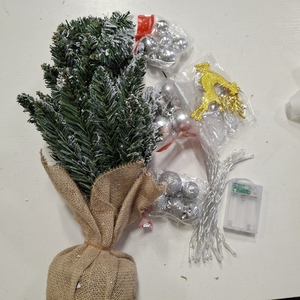 lot 1480 image: 12 INCH TABLE CHRISTMAS TREE WITH ORNAMENTS AND LIGHTS