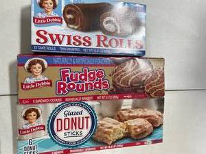 lot 2050 image: 3 Boxes Little Debbie Variety Pack. 1 Box Swiss Rolls, 1 Box Fudge Rounds, 1 Box Glazed Donut Sticks