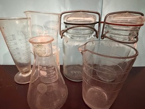 lot 143 image: Vintage Measuring Beakers and Jars in a Basket