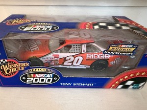 lot 221 image: NASCAR Diecast Cars, Hasbro Winners Circle 19992000 Tony Stewart Home Depot and Racing Champions Exide Batteries