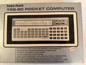lot 238 image: Vintage Radio Shack TSR-80 Pocket Computer, Appears New in Package w Case, Serial No 21092291