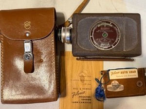 lot 341 image: Bell & Howell Filmo Auto Load 16mm Movie Camera w Case and Manual
