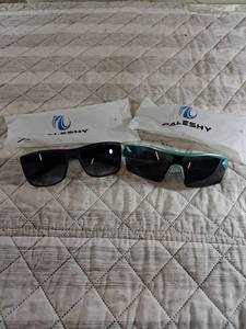 lot 43 image: PALESHY Sports Sunglasses Set - Black and Teal Frames