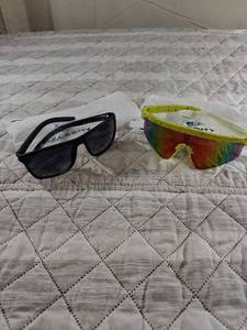 lot 49 image: Two Pairs Sports Sunglasses Black and Yellow Frames