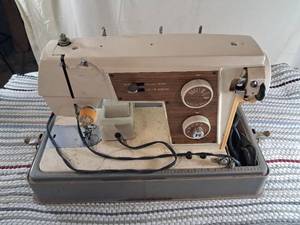 lot 86 image: Precision Built Sewing Machine Made in Japan with Carrying Case needle goes up and down