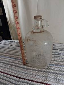 lot 93 image: One Gallon Clear Glass Jug with Handle and screw on lid