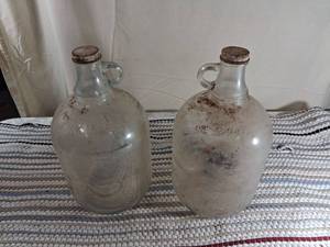 lot 95 image: Clear Glass Gallon Jugs with screw on lids Set of 2