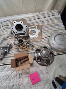 lot 112 image: Mixed Automotive Parts Lot - Engine Components and Wheel Covers