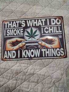 lot 167 image: Cannabis Themed Metal Sign Thats What I Do I Smoke and I Know Things