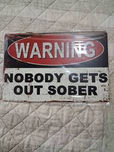 lot 168 image: Warning Nobody Gets Out Sober Metal Sign