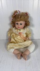 lot 314 image: Heritage Mint Porcelain Doll with Yellow Dress and Curly Hair