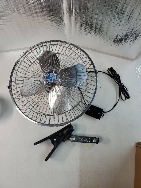 lot 36271 image: 10-Inch Silver Cigarette Lighter Fan, Two-Speed Adjustment, 360-Degree Rotation, Clip-On Design 12 Volt Fan, Perfect for Cars, Trucks, RVs and More (Cord Length 6.56FT) - Retail $29