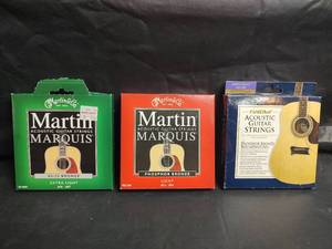 lot 26 image: Martin Marquis and First Act Acoustic Guitar String Sets