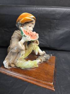 lot 313 image: Limoges Creations Boy with Watermelon Porcelain Figurine