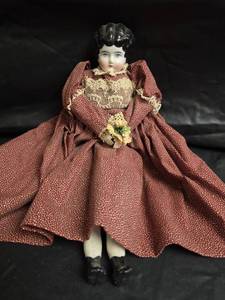lot 468 image: Porcelain Head Doll in Burgandy Polka Dot Dress with Lace Trim- 12in Doll