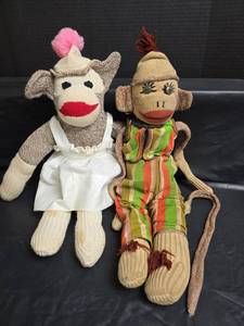 lot 486 image: Handmade Sock Monkey Pair with Traditional Clothing- Both Need Minor Repairs
