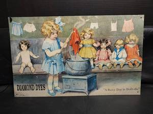 lot 515 image: Diamond Dyes A Busy Day in Dollville Advertising Metal Sign, 16 x 10