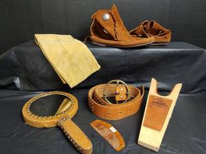 lot 552 image: Leather Western Period Belt and Moccasins, Leather Hand Mirror and More