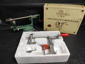 lot 602 image: The Pampered Chef Apple Peeler Corer Slicer with Original Box and Back to Basics Apple Corer