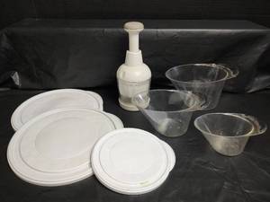 lot 681 image: Pampered Chef Food Chopper, Measuring Cups, and Assorted Lids