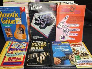 lot 732 image: Assorted Guitar, Dulcimer, Banjo, Recorder, Mandolin, Fingerpicking Music Instruction Books