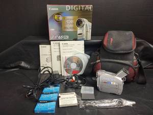 lot 777 image: Canon ZR65 MC MiniDV Digital Video Camcorder with Carrying Case and More, Powers On