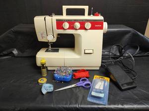 lot 907 image: Brother VX-1100 Sewing Machine with Accessories