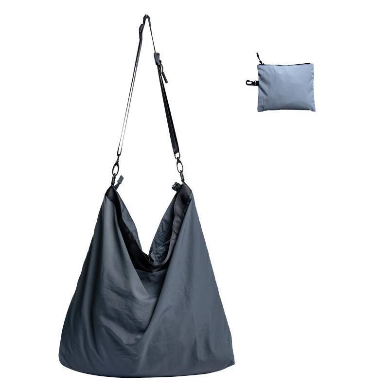 lot 41534 image: Fynarzel Lightweight Foldable Nylon Crossbody Bag, Stylish Compact Polyester Packable Totes, Simple Collapsible Handbag for Travel, Gym, Sports, Everyday Use - Gray, Gifts for Christmas - Retail $25