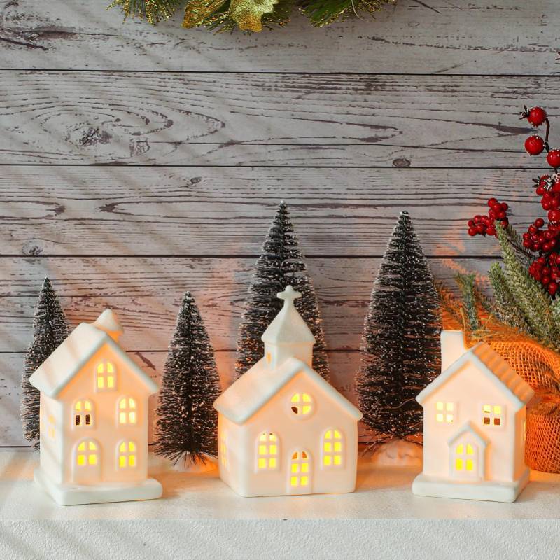 lot 45717 image: Peninpha 7PCS Christmas Village Sets - 3 LED Lighted Ceramic White Houses with 4 Decorative Christmas Trees Remote Control Led Candles for Xmas Home Tabletop Mantel Shelf Decor - Retail $25