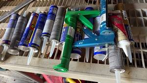 lot 59107 image: Manual Caulk Gun with Assorted Sealant and Adhesive Tubes - Retail $25